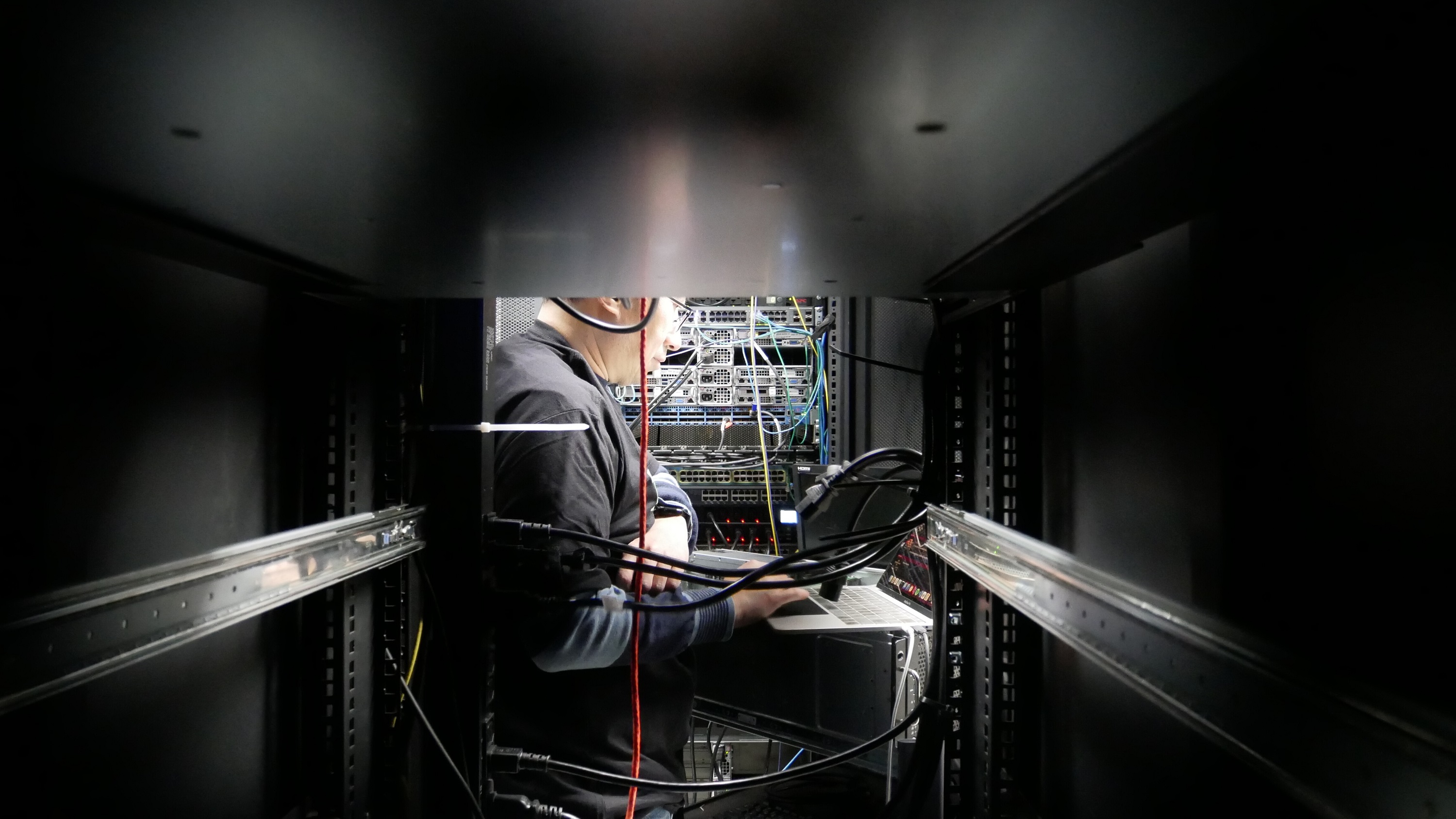 TensorDock technician installing servers